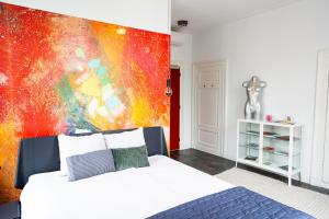 Postel nebo postele na pokoji v ubytování Boetiekhotel Villa Wanrooy