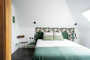 Postel nebo postele na pokoji v ubytování Boetiekhotel Villa Wanrooy