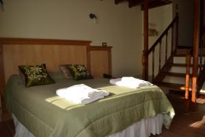 מיטה או מיטות בחדר ב-Valle Frío Ushuaia