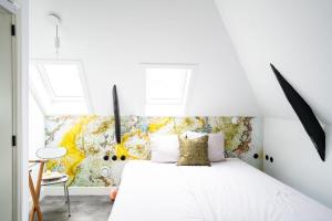 Postel nebo postele na pokoji v ubytování Boetiekhotel Villa Wanrooy