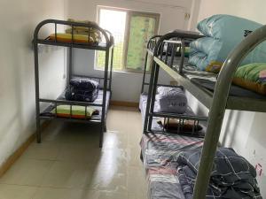 Katil atau katil-katil dalam bilik di Shenzhen Zhongge Budget Homestay Pingzhou Subway Station Branch