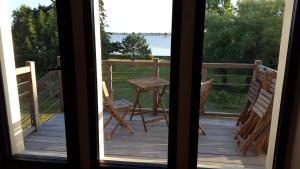 a view of a porch with a table and chairs at Manoir de Larmor in Vannes