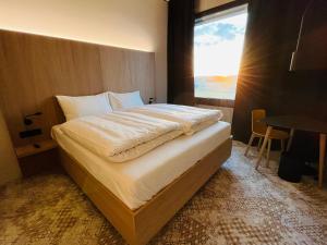 Ліжко або ліжка в номері Boulderbar Hotel Leonding