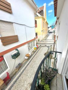 a view of a street from the balcony of a building at Cascais Historic Villa in Cascais