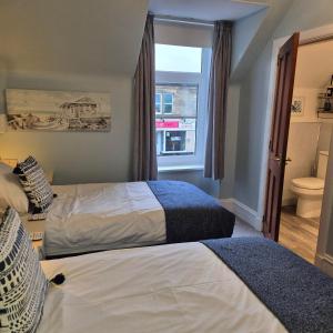 Postel nebo postele na pokoji v ubytování Kintrae B&B
