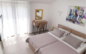 Voodi või voodid majutusasutuse Amazing Home In Ploce toas