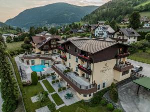 an aerial view of a house with a pool at Alpine Spa Residence in Bad Kleinkirchheim