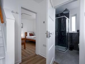 a bathroom with a shower with a glass door at Golfers Haven Links Cottage Crail - Pass the Keys in Crail +35 photos