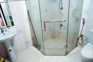 a shower with a glass door in a bathroom at Eco Villa in Ambalangoda +5 photos