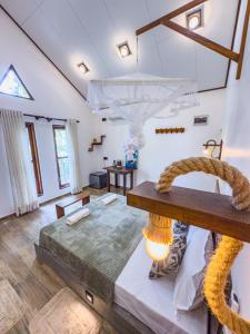 a bedroom with a large bed in a room at EdenHaven Cottage in Udawalawe