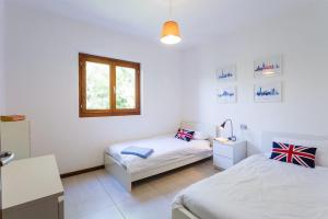 Ένα ή περισσότερα κρεβάτια σε δωμάτιο στο Villa Sereni - 115