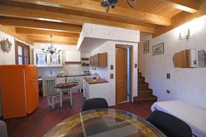 a kitchen and living room with a table in a room at Kleopatra's House in Karavostamo