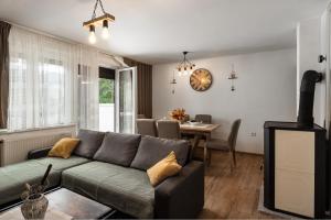 a living room with a couch and a table at Kuća za odmor Iva in Lič