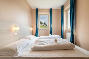 Posteľ alebo postele v izbe v ubytovaní Residence La Villa Principe + 30 fotografií
