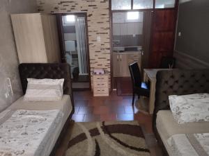 Postel nebo postele na pokoji v ubytování Apartmani Studio