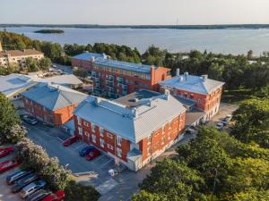 an aerial view of a building with a parking lot at EC-Hostel in Vaasa