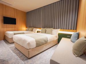 TV a/nebo společenská místnost v ubytování The GALA Hotel Umeda