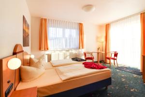 Postel nebo postele na pokoji v ubytování Aparthotel Leuchtfeuer Rügen