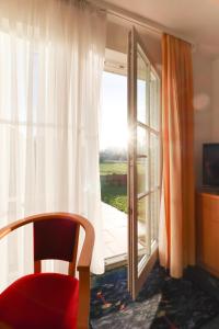 TV a/nebo společenská místnost v ubytování Aparthotel Leuchtfeuer Rügen