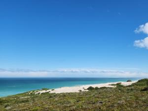 a view of the ocean from the top of a beach at Aloe Cottage in Cloeteskraal