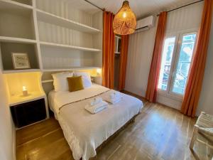 Posteľ alebo postele v izbe v ubytovaní ''Rooftop'' Superbe T3 quartier haut avec Rooftop privé!