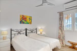 Postel nebo postele na pokoji v ubytování Casa Cacteae + 17 fotografií