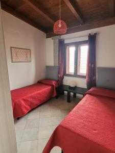 A bed or beds in a room at AGRITURISMO VIGNA DE' LUCERI