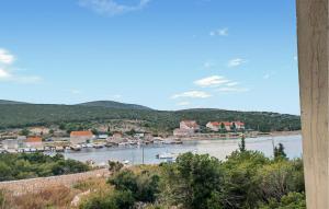 a view of a river with houses and a town at Awesome Apartment In Otok Ist With Wifi in Ist