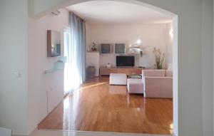 a living room with a couch and a table at Awesome Apartment In Otok Ist With Wifi in Ist +11 photos