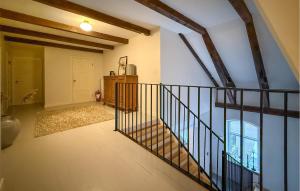 an empty hallway with a staircase in a house at Nice Home In Ekeby With Wifi in Ekeby +33 photos