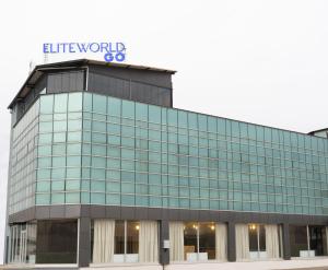 a glass building with a sign on top of it at Elite World GO İnegöl in Inegol