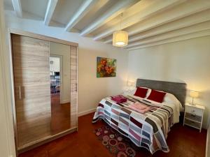 a bedroom with a bed with red pillows on it at Sologne des étangs - Bontens in Saint-Viâtre