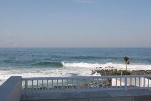 a view of the ocean from a balcony at Cowrie Cove 5 in Ballito