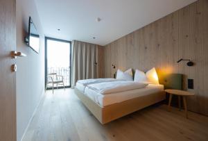 Postel nebo postele na pokoji v ubytování Appartements Kammerlander