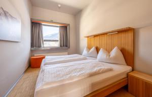 Postel nebo postele na pokoji v ubytování Appartements Kammerlander