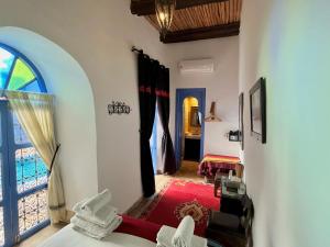 Ένα ή περισσότερα κρεβάτια σε δωμάτιο στο Riad Chameleon