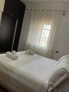 Postel nebo postele na pokoji v ubytování Guest House Ilir