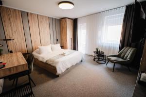 Postel nebo postele na pokoji v ubytování Hotel Tomas