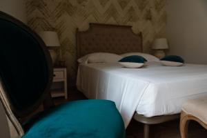 Posteľ alebo postele v izbe v ubytovaní B&B Donna Cinzia