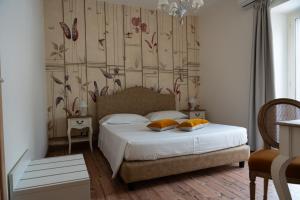 Posteľ alebo postele v izbe v ubytovaní B&B Donna Cinzia