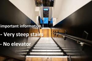 an empty staircase in a building with no elevator at Historic Centre Hotel in Amsterdam