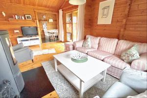 a living room with a couch and a table at Ferienhaus Neckar 58 in Hayingen