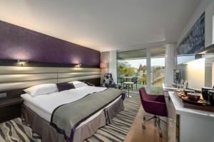 Mövenpick Hotel Lausanne客房内的一张或多张床位