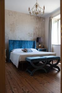 Posteľ alebo postele v izbe v ubytovaní B&B Donna Cinzia