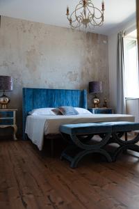Posteľ alebo postele v izbe v ubytovaní B&B Donna Cinzia