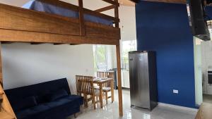 a living room with a couch and a loft bed at Residencial Mineiro - Studio in Itapoa