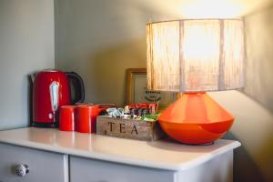 an orange lamp sitting on top of a table at Smarties Guest House in Newquay