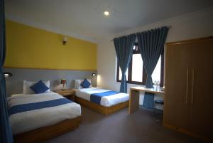 Krevet ili kreveti u jedinici u okviru objekta Gaurishankar Backpackers hostel +37 fotografija