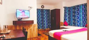 TV a/nebo společenská místnost v ubytování Kevins Bearshola Residency