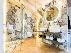 a bathroom with two sinks and a shower at Villa Rêverie - Boutique Hotel in Bellano